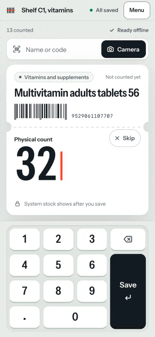 The app on a phone: a product card, the count being typed on a large keypad with a tall Save key, and a lock line saying the system stock shows after saving.